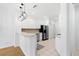 Bright kitchen featuring white cabinets, stainless steel appliances, and modern pendant lighting at 11422 Captiva Kay Dr, Riverview, FL 33569