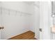 Spacious walk-in closet with wire shelving and wood-look floors at 11422 Captiva Kay Dr, Riverview, FL 33569