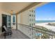 Relaxing balcony features seating area and stunning views of the beach and ocean at 1180 Gulf Blvd # 1604, Clearwater Beach, FL 33767