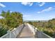 Scenic wooden walkway leads to a beautiful beach, offering a tranquil coastal experience at 1180 Gulf Blvd # 1604, Clearwater Beach, FL 33767