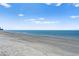 Scenic beach view with calming waters and a clear sky, perfect for relaxation and waterfront activities at 1180 Gulf Blvd # 1604, Clearwater Beach, FL 33767