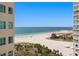 Expansive beach view with white sand and clear blue waters from a high-rise balcony at 1180 Gulf Blvd # 1604, Clearwater Beach, FL 33767