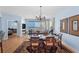 Open-concept dining room with ocean view, decorative chandelier, and access to the kitchen at 1180 Gulf Blvd # 1604, Clearwater Beach, FL 33767