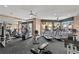 Well-equipped gym with modern cardio machines, weightlifting equipment, and abundant natural light at 1180 Gulf Blvd # 1604, Clearwater Beach, FL 33767