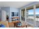Charming living room with an expansive view of the ocean and sliding glass doors to a large balcony at 1180 Gulf Blvd # 1604, Clearwater Beach, FL 33767