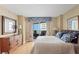 Comfortable main bedroom featuring a balcony with ocean view and beautiful decorations at 1180 Gulf Blvd # 1604, Clearwater Beach, FL 33767