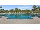 Inviting pool area surrounded by lush landscaping, providing a serene oasis for relaxation and recreation at 1180 Gulf Blvd # 1604, Clearwater Beach, FL 33767