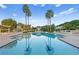 Inviting swimming pool with crystal-clear water, poolside lounge chairs, and a relaxing ambiance at 1180 Gulf Blvd # 1604, Clearwater Beach, FL 33767