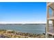 Scenic water view from high-rise condo, showcasing the bay, beach access, and parking areas at 1180 Gulf Blvd # 1604, Clearwater Beach, FL 33767