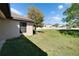 Spacious backyard featuring a lush lawn and privacy fence, perfect for outdoor activities at 12220 Legacy Bright St, Riverview, FL 33578