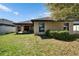 Well-maintained backyard with a covered patio, offering ample space for outdoor enjoyment at 12220 Legacy Bright St, Riverview, FL 33578