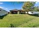 Backyard shot from an angle showing size, fence line and proximity to neighbors at 12220 Legacy Bright St, Riverview, FL 33578
