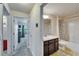 Bathroom featuring a sink, vanity, mirror, and bathtub with shower at 12220 Legacy Bright St, Riverview, FL 33578