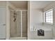 Bathroom featuring a shower and a bathtub next to a window at 12220 Legacy Bright St, Riverview, FL 33578