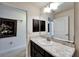 Bathroom featuring a sink, vanity, mirror, and dark cabinets at 12220 Legacy Bright St, Riverview, FL 33578