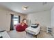 Bedroom featuring a beanbag chair, window and decor at 12220 Legacy Bright St, Riverview, FL 33578