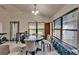 Bright dining area with natural light and views of backyard, and tile flooring at 12220 Legacy Bright St, Riverview, FL 33578