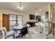 Open floor plan combines dining room and kitchen with tile flooring at 12220 Legacy Bright St, Riverview, FL 33578