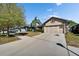 Beautiful home featuring a two-car garage, stone accents, and mature landscaping at 12220 Legacy Bright St, Riverview, FL 33578