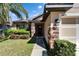 Close up of a home's entrance with stone accents and professional landscaping at 12220 Legacy Bright St, Riverview, FL 33578