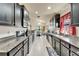 Contemporary kitchen equipped with stainless steel appliances, granite countertops and ceramic tile flooring at 12220 Legacy Bright St, Riverview, FL 33578