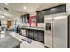 Functional kitchen featuring stainless steel appliances, sleek cabinets, and tiled floors at 12220 Legacy Bright St, Riverview, FL 33578