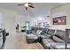 Living room featuring vaulted ceilings, comfortable seating, and natural light at 12220 Legacy Bright St, Riverview, FL 33578