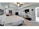 Bright main bedroom with large bed, TV, and ample space at 12220 Legacy Bright St, Riverview, FL 33578