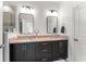 Modern bathroom featuring a double vanity with granite countertops, framed mirrors, and a shower at 12377 Streambed Dr, Riverview, FL 33579