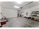Spacious two car garage with ample storage space and room for a workshop at 12377 Streambed Dr, Riverview, FL 33579