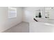 Bright upstairs hallway area features carpet, white walls, and natural light at 12377 Streambed Dr, Riverview, FL 33579