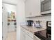 Modern kitchen with a pantry, subway tile backsplash and stainless steel appliances at 12377 Streambed Dr, Riverview, FL 33579
