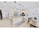 Well-lit kitchen featuring a center island, stainless steel appliances, and sleek countertops at 12377 Streambed Dr, Riverview, FL 33579