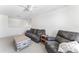 Comfortable living room space featuring a sofa, chair, and coffee table at 12377 Streambed Dr, Riverview, FL 33579