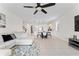 Spacious living room with comfortable seating, great natural light, and neutral decor at 12377 Streambed Dr, Riverview, FL 33579