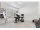 Bright office featuring a large window, a desk, and carpeted floors with baseball-themed decorations at 12377 Streambed Dr, Riverview, FL 33579