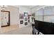 Bright office featuring a large window, a desk, and carpeted floors with baseball-themed decorations and art at 12377 Streambed Dr, Riverview, FL 33579
