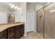 Bathroom featuring granite countertops, a shower, and tile flooring at 12919 Whittington Ct, Largo, FL 33773