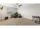 Bedroom with a ceiling fan, neutral paint, and ample space for a work space at 12919 Whittington Ct, Largo, FL 33773