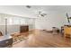 A spacious bonus room with hardwood floors, recessed lighting, and a ceiling fan at 12919 Whittington Ct, Largo, FL 33773