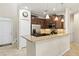 Kitchen with granite countertops, pendant lights, stainless appliances, and adjacent dining area at 12919 Whittington Ct, Largo, FL 33773
