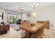 Open-concept living and dining area with tile flooring and access to the backyard at 12919 Whittington Ct, Largo, FL 33773