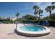 Community hot tub and lounge seating with tropical landscaping and resort-style setting at 1316 Pasadena S Ave # 301, South Pasadena, FL 33707