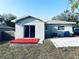 Backyard featuring a patio and a sliding glass door at 1409 Franklin St, Clearwater, FL 33756