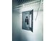 Indoor electrical panel box attached to the wall with wire shelving at 1409 Franklin St, Clearwater, FL 33756
