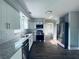 Bright kitchen boasting stainless steel appliances, granite countertops, subway tile, and wood-look floors at 1409 Franklin St, Clearwater, FL 33756
