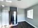 Eat-in kitchen area with stainless steel refrigerator, ample cabinet space, and wood-look floors at 1409 Franklin St, Clearwater, FL 33756