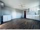 Modern kitchenette with white cabinets and sink, and a ceiling fan at 1409 Franklin St, Clearwater, FL 33756