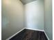 Walk-in closet with wood-look floor, gray walls, and bright, natural light at 1409 Franklin St, Clearwater, FL 33756