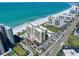 Beautiful aerial view of beachside condos, pristine beach, and sparkling turquoise water at 1480 Gulf Blvd # 401, Clearwater Beach, FL 33767